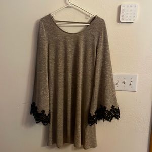 A stunning dress with wide lace trim sleeves!